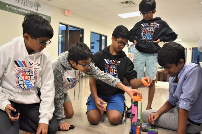 Members of Franklin-based Robitx Institute's competition robotics team, Vihaan Bussa, Kesh Patel, Nikhil Inavolu, Teddy Alapati and Preetham Dyapa, demonstrate a robot prototype at Robitx Institute in Franklin, Tenn. on Thursday, June 2, 2022.
